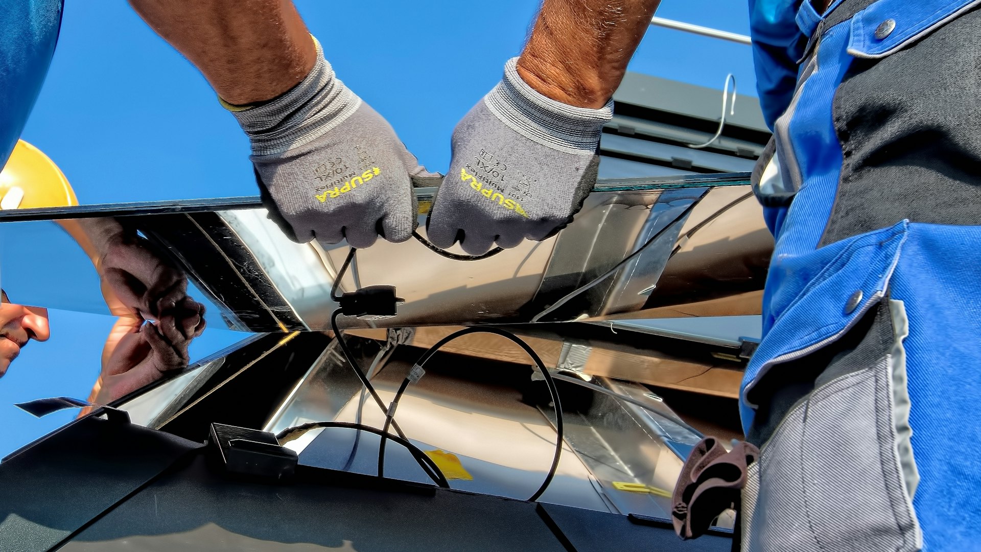Technician wiring a solar panel