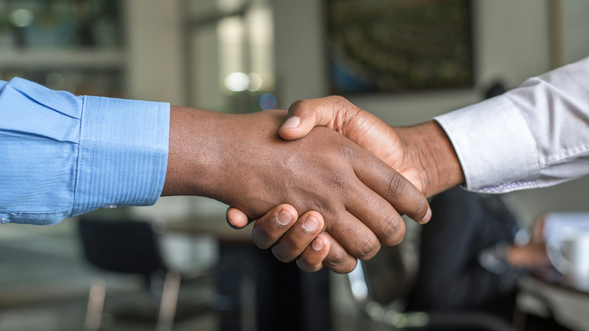 Two business partners shaking hands